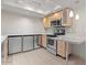 Modern kitchen with light wood cabinets and stainless steel appliances at 4200 N Miller Rd # 526, Scottsdale, AZ 85251