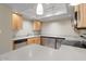 Modern kitchen with light wood cabinets and stainless steel appliances at 4200 N Miller Rd # 526, Scottsdale, AZ 85251