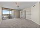 Spacious living room with balcony access and city views at 4200 N Miller Rd # 526, Scottsdale, AZ 85251