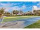 Community basketball court with playground in background at 42276 W Chisholm Dr, Maricopa, AZ 85138