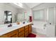 Double vanity bathroom with soaking tub and shower at 42276 W Chisholm Dr, Maricopa, AZ 85138