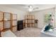 Serene bedroom with room divider, window seat, and decorative accents at 42276 W Chisholm Dr, Maricopa, AZ 85138