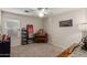 Charming bedroom with organ, shelving, and window seating at 42276 W Chisholm Dr, Maricopa, AZ 85138