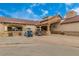 Rancho El Dorado clubhouse exterior with golf cart parking at 42276 W Chisholm Dr, Maricopa, AZ 85138