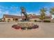 Rancho El Dorado clubhouse with a stunning horse statue at 42276 W Chisholm Dr, Maricopa, AZ 85138