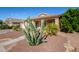 Front view of the house with cacti and desert plants at 42276 W Chisholm Dr, Maricopa, AZ 85138