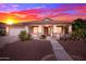 Inviting single-story home featuring manicured desert landscaping, a covered porch, and a two-car garage at 42276 W Chisholm Dr, Maricopa, AZ 85138