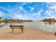 Relaxing lake view with bench seating at 42276 W Chisholm Dr, Maricopa, AZ 85138