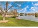 Scenic lake with fountain and walking paths at 42276 W Chisholm Dr, Maricopa, AZ 85138