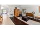 Living room with dark hardwood floors and wooden furniture at 42276 W Chisholm Dr, Maricopa, AZ 85138