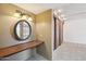 Bathroom vanity with granite countertop, mirror and dark wood cabinets at 43006 N 3Rd Ave, New River, AZ 85087