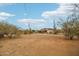 Wide angle view of the home with desert landscaping and cacti in the yard at 43006 N 3Rd Ave, New River, AZ 85087