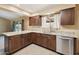 Well-lit kitchen with granite countertops, stainless steel appliances, and a view of the backyard at 43006 N 3Rd Ave, New River, AZ 85087