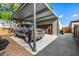 Covered carport with additional storage and adjacent grilling area at 4368 E Estrella Ct, Gilbert, AZ 85296