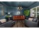 Cozy sitting room with dark walls and a chandelier at 4368 E Estrella Ct, Gilbert, AZ 85296