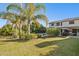 Landscaped backyard with pool, patio, and lush greenery at 4376 E Anderson Dr, Phoenix, AZ 85032