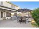 Covered patio with seating area, umbrella, and outdoor heater at 4376 E Anderson Dr, Phoenix, AZ 85032