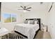 Large bedroom with plush bed, window shutters, and a modern nightstand at 4376 E Anderson Dr, Phoenix, AZ 85032