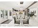 Bright dining room features a glass table with gray chairs and access to the backyard at 4376 E Anderson Dr, Phoenix, AZ 85032