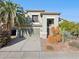 Two-story house with a two-car garage and desert landscaping at 4376 E Anderson Dr, Phoenix, AZ 85032