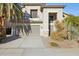 Two-story house with a two-car garage and desert landscaping at 4376 E Anderson Dr, Phoenix, AZ 85032