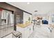 Open concept kitchen with stainless steel appliances and granite island, overlooking living room at 4376 E Anderson Dr, Phoenix, AZ 85032