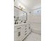 Bathroom with double vanity and marble tile at 4501 E Paradise Ln, Phoenix, AZ 85032