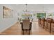 Modern dining room with a view of the kitchen and fireplace at 4501 E Paradise Ln, Phoenix, AZ 85032