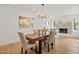 Dining area with wood table and chandelier at 4501 E Paradise Ln, Phoenix, AZ 85032