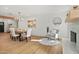 Bright dining room features a wood table, chandelier, and fireplace at 4501 E Paradise Ln, Phoenix, AZ 85032