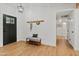 Light and airy entryway with a bench and coat hooks at 4501 E Paradise Ln, Phoenix, AZ 85032