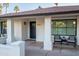 Inviting front porch with modern chairs and a stylish door at 4501 E Paradise Ln, Phoenix, AZ 85032