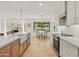 Modern kitchen with farmhouse sink and white cabinets at 4501 E Paradise Ln, Phoenix, AZ 85032