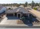 Single story home with two car garage and desert landscaping at 4557 W Agave Ave, Eloy, AZ 85131