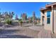 Landscaped backyard with gravel, plants, and a patio area at 4557 W Agave Ave, Eloy, AZ 85131