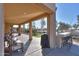 Covered patio with built-in BBQ, seating area, and artificial turf at 4557 W Agave Ave, Eloy, AZ 85131