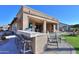 Outdoor kitchen and patio area with seating at 4557 W Agave Ave, Eloy, AZ 85131