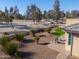 Desert landscaping with gravel, artificial turf, and a patio at 4557 W Agave Ave, Eloy, AZ 85131