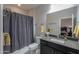 Bathroom with shower/tub combo and dark vanity at 4557 W Agave Ave, Eloy, AZ 85131