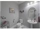 Clean bathroom with pedestal sink and updated fixtures at 4557 W Agave Ave, Eloy, AZ 85131