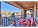 Covered patio with red bench, table and decorative rug at 4557 W Agave Ave, Eloy, AZ 85131