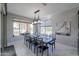 Bright dining room with large table and chandelier at 4557 W Agave Ave, Eloy, AZ 85131