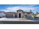 Single story home with stone accents and a two car garage at 4557 W Agave Ave, Eloy, AZ 85131