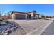 House exterior showing a driveway, garage and landscaping at 4557 W Agave Ave, Eloy, AZ 85131