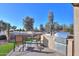 Patio seating area with chairs, table, and outdoor kitchen at 4557 W Agave Ave, Eloy, AZ 85131