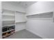 Bright walk-in closet with built-in shelving and rods at 4557 W Agave Ave, Eloy, AZ 85131