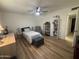 Bedroom with twin bed, dresser, and ceiling fan at 4624 E Emerald Ave, Mesa, AZ 85206