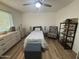 Bedroom with twin bed, dresser, and ceiling fan at 4624 E Emerald Ave, Mesa, AZ 85206