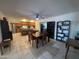 Dining area with a dark wood table and four chairs. Kitchen is visible at 4624 E Emerald Ave, Mesa, AZ 85206