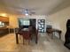 Dining area with a dark wood table and four chairs. Kitchen is visible at 4624 E Emerald Ave, Mesa, AZ 85206